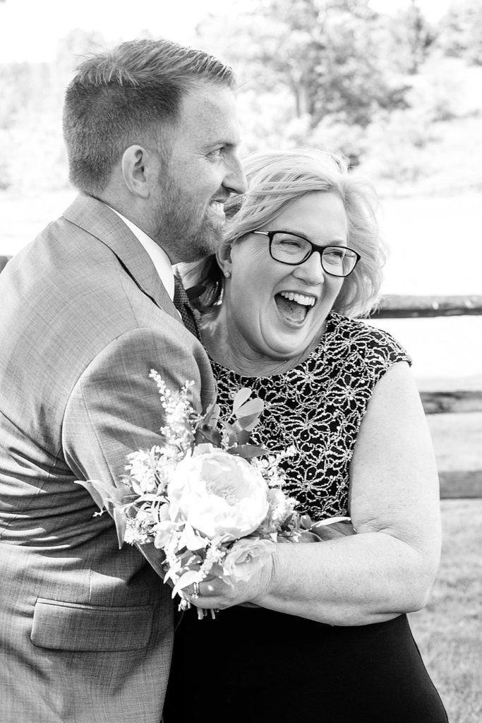 Groom laughs with his mom at Gillbrook Farms by the Jepsons
