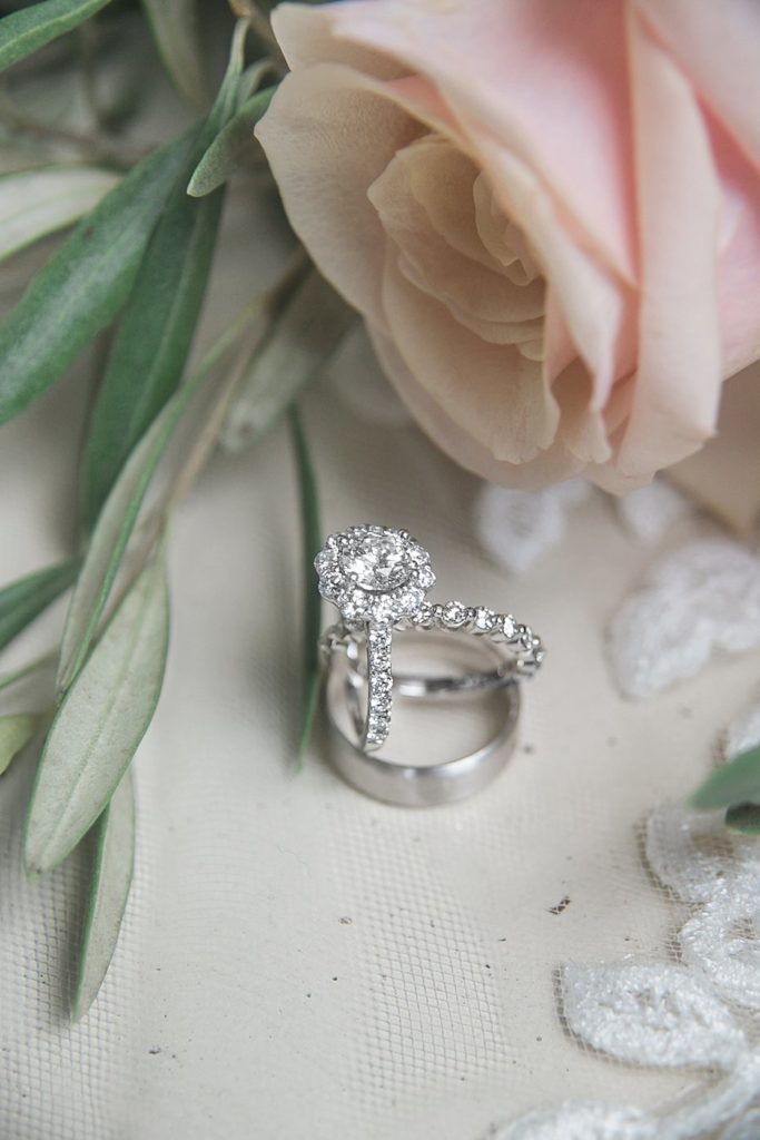 wedding rings with florals and lace at White Chimneys wedding
