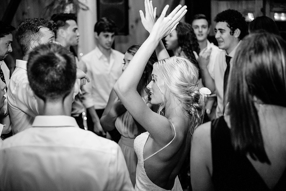 Bride dances with friends during wedding reception at White Chimneys PA