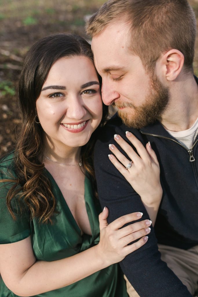Couple cuddling in State College, PA during engagement session