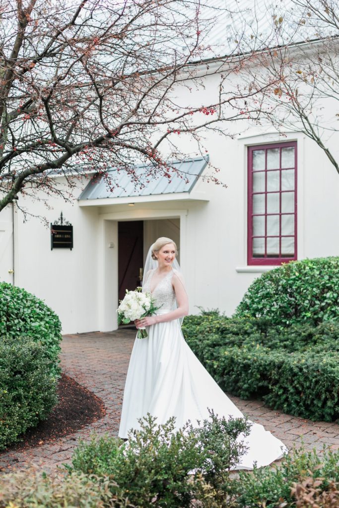 Bride posing at the Inn at Leola Village by the Jepsons
