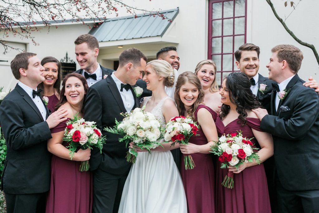 bridal party wearing wine red dresses and black tuxes the Inn at Leola Village by the Jepsons