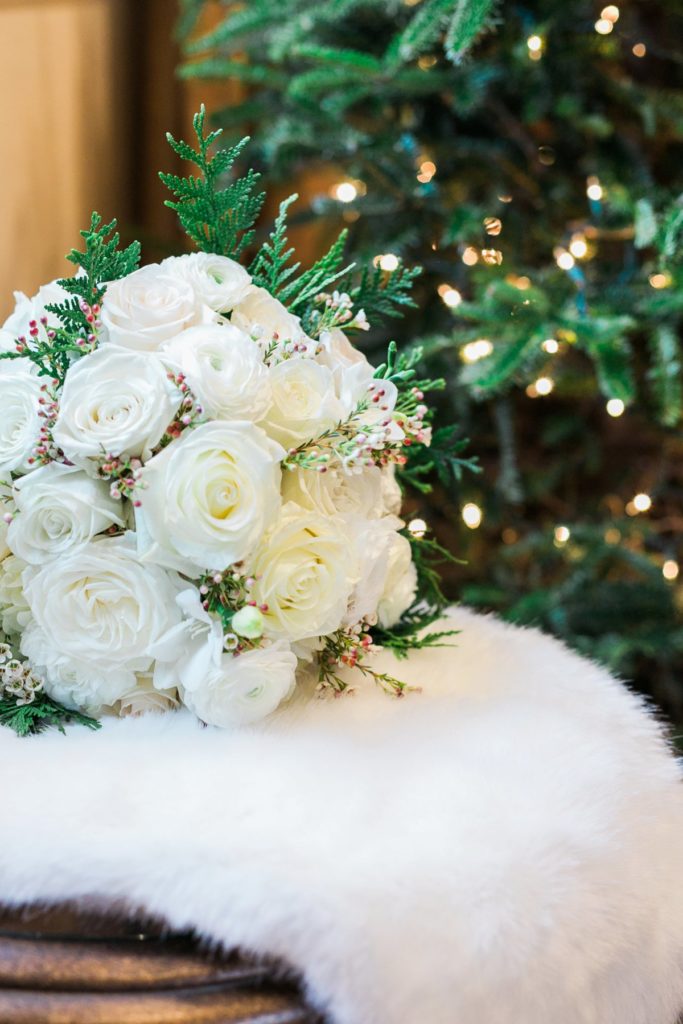 white bouquet with Christmas twinkle lights at the Inn at Leola Village by the Jepsons