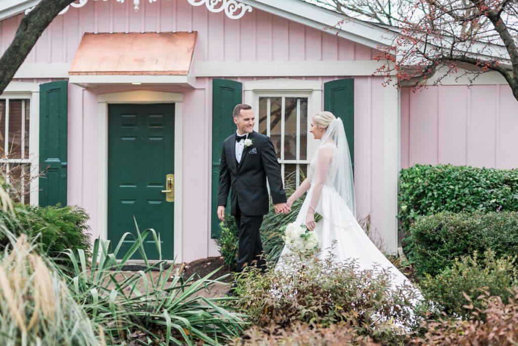 Bride and groom walking at wedding venue the Inn at Leola Village by the Jepsons