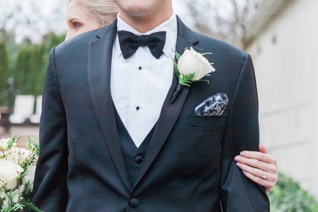 Groom wearing black bow tie at the Inn at Leola Village by the Jepsons