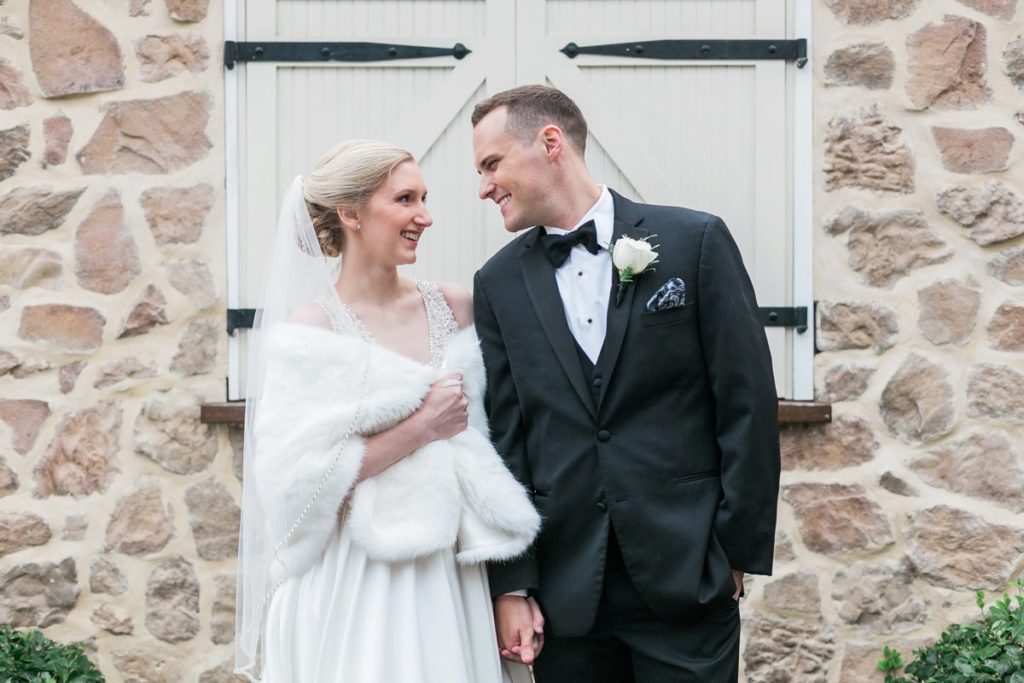 Bride and groom at winter wedding venue the Inn at Leola Village by the Jepsons