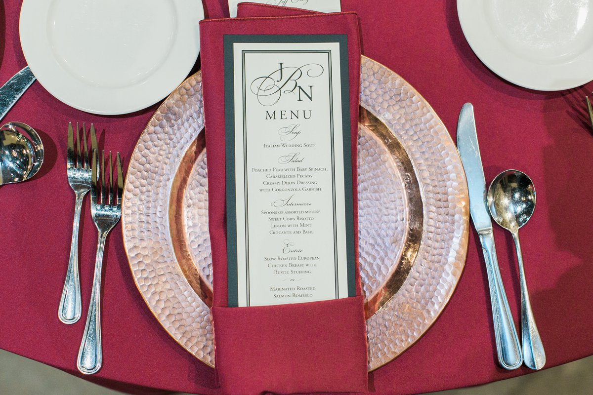 Reception dinner menu card design with red napkin for Christmas wedding at the Inn at Leola Village by the Jepsons