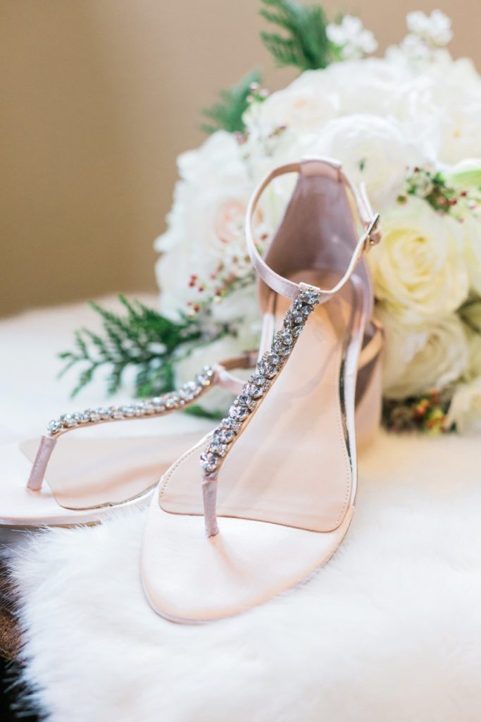 Bridal shoes with white bouquet at the Inn at Leola Village by the Jepsons