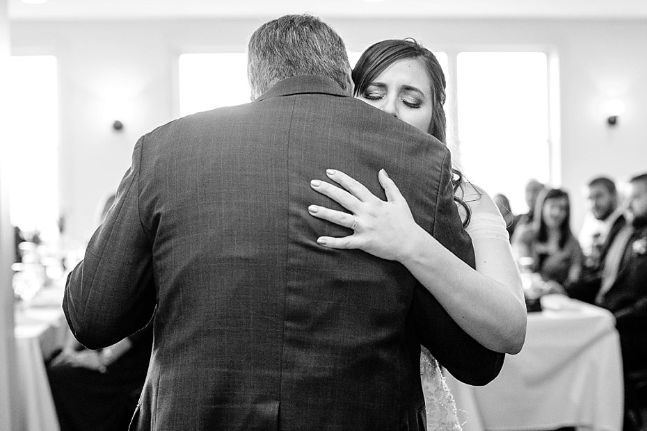bride tearfully hugs dad during dance at Above the Valley wedding venue by the Jepsons