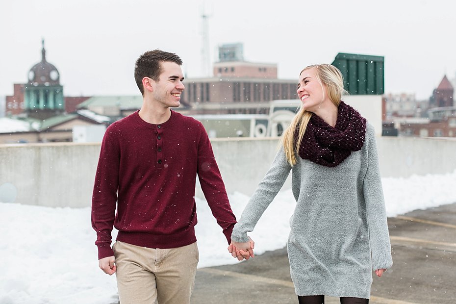 engaged couple holds hands on rooftop in lancaster pennsylvania