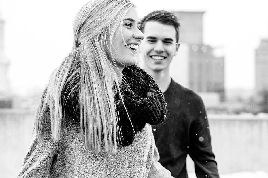 engaged couple laughing together