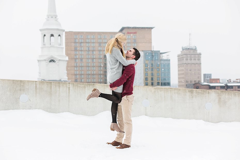 groom lifts bride on rooftop in lancaster pennsylvania by the Jepsons