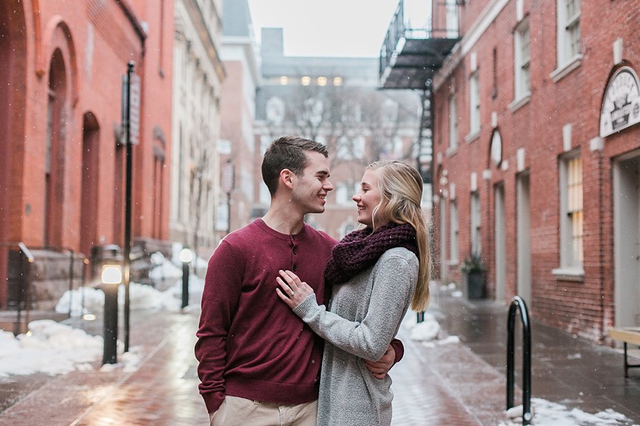 engaged couple laughs outside Central Market in Lancaster PA | private photo editor located in PA