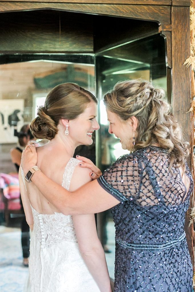 bride with mom during emotional moment at Gillbrook Farms