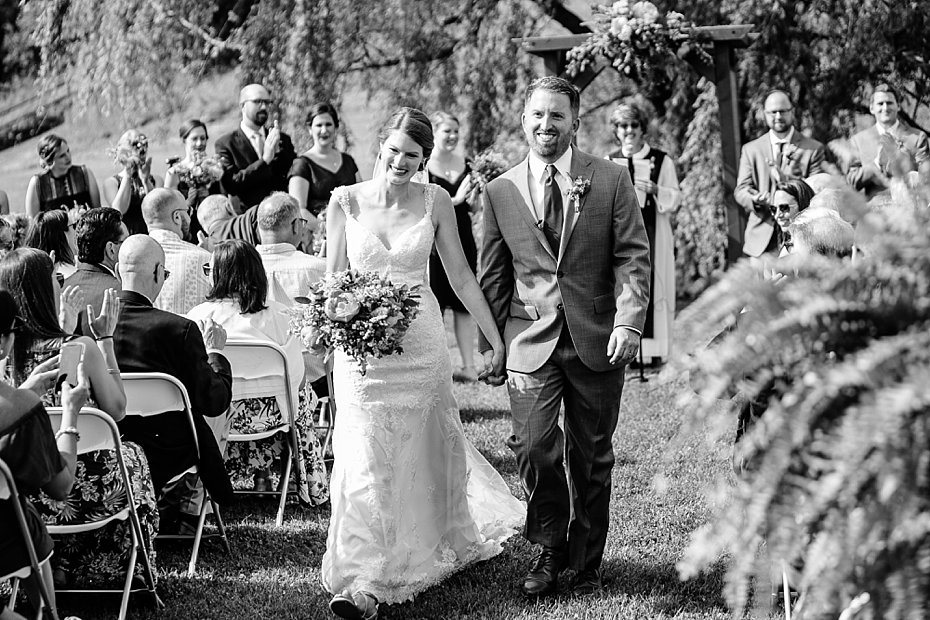 Bride and groom walk back down the aisle at Gillbrook Farms