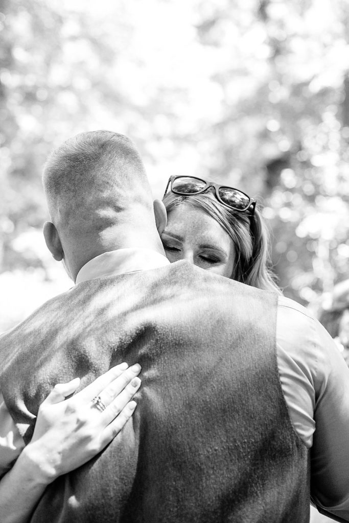 groom hugs sister after outdoor ceremony at Fern Hill Weddings