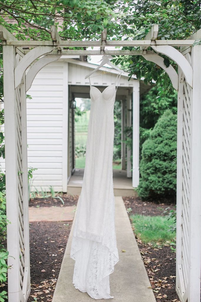 wedding dress hanging in archway at White Chimneys in Gap PA
