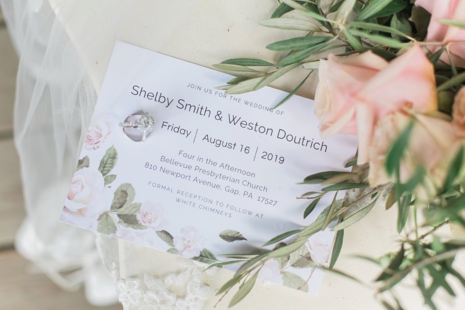 wedding invitation with florals and lace