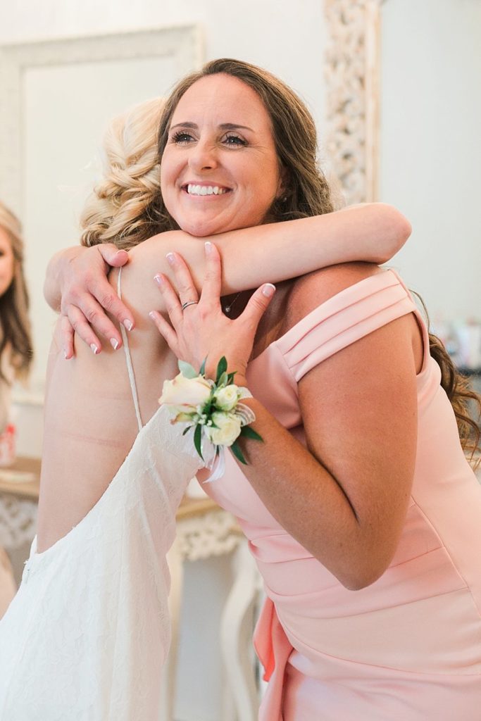 bride and mother embrace at White Chimneys wedding in Gap PA
