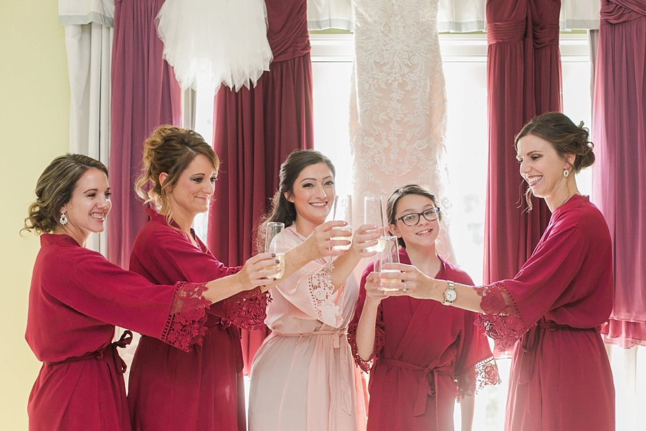 bride and bridesmaids toast champagne at Omni Bedford Springs
