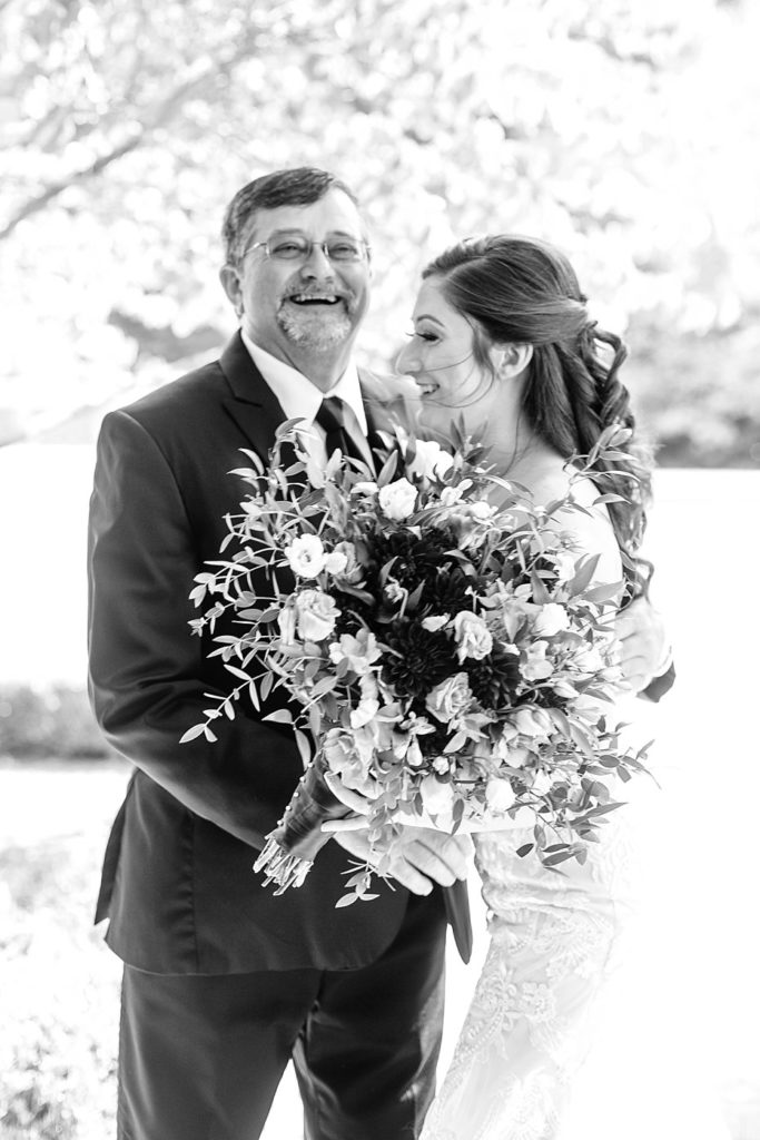 Father and daughter laugh together at Omni Bedford Springs wedding