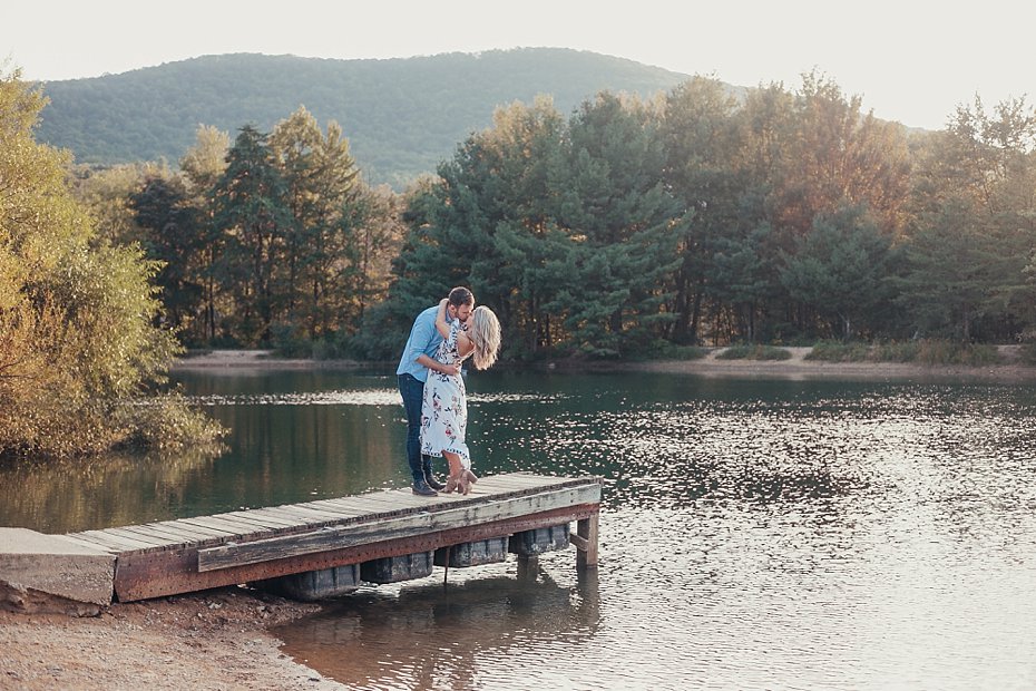 Bride and groom on pond dock at Tussey Mountain